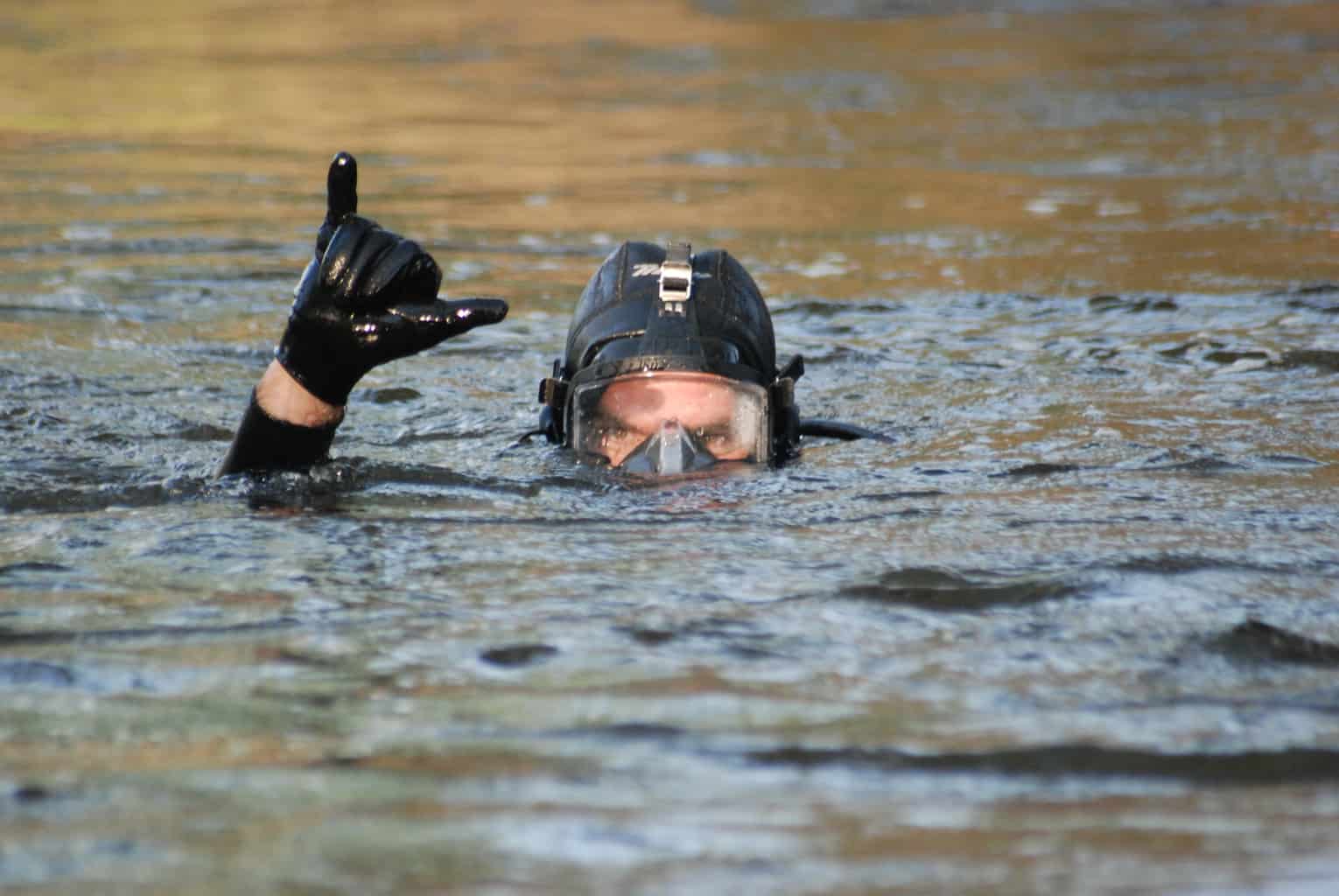 dive rescue international diver showing shaka